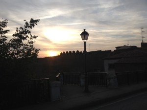 Sun rising over city's ramparts